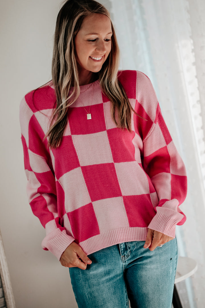 womens pink checkerboard print knit sweater oversize