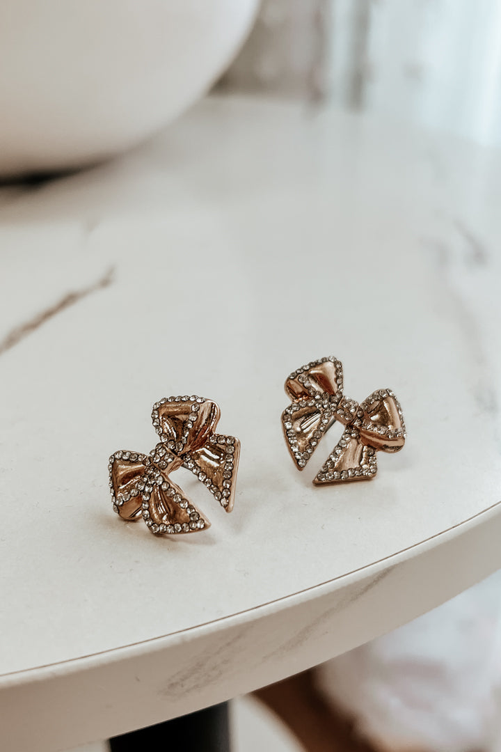 gold and rhinestone bow post earrings