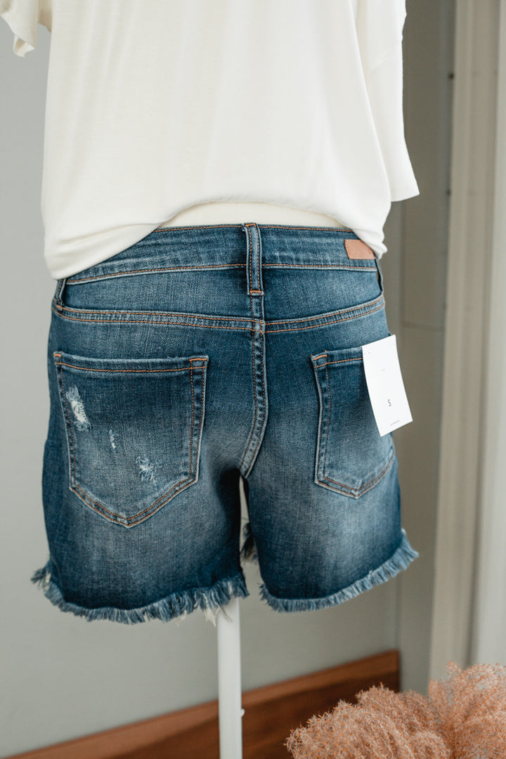 raw edge distressed mid-rise shorts for women